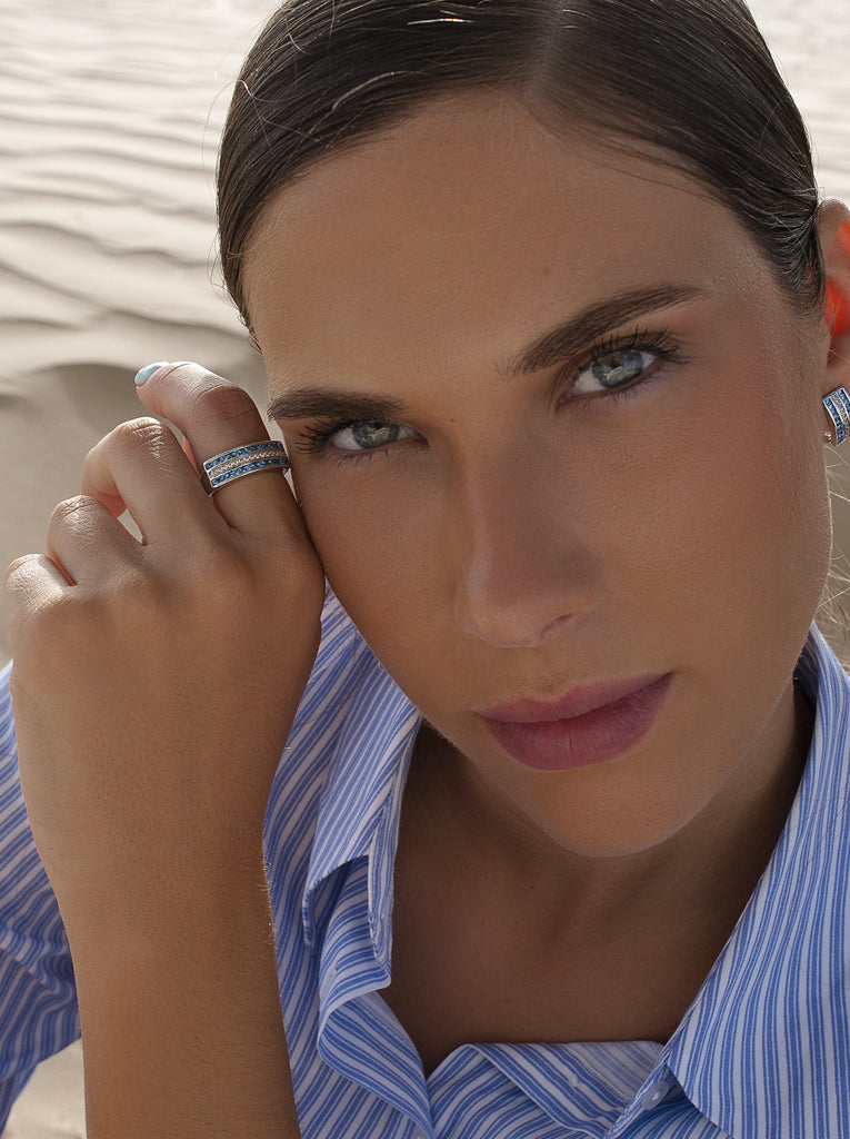 Wide silver ring with blue cubic zirconia