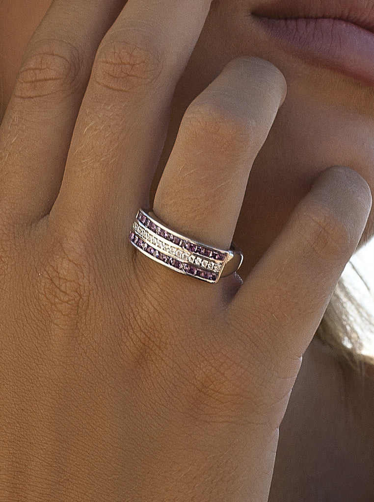 Silver ring with pink stones and a line of cubic zirconia