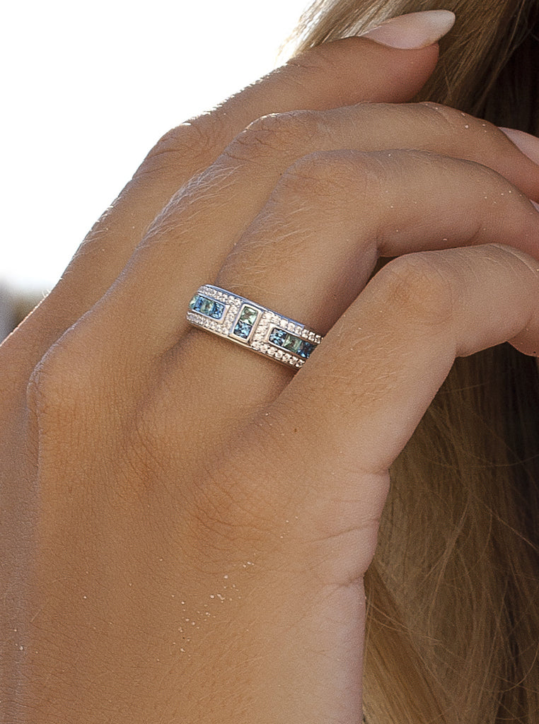 Silver ring with blue and green stones and cubic zirconia