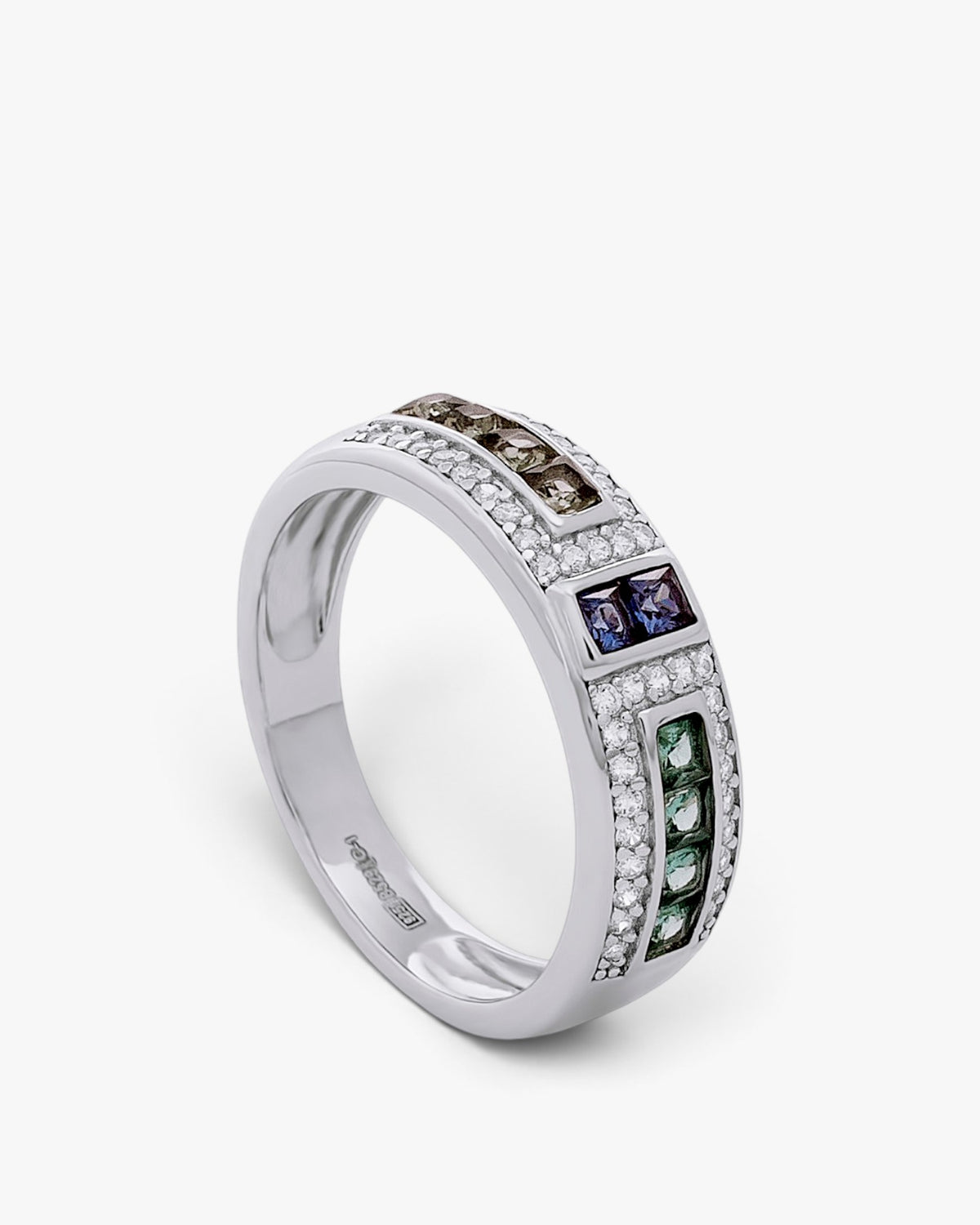 Silver ring with green, purple, and champagne stones