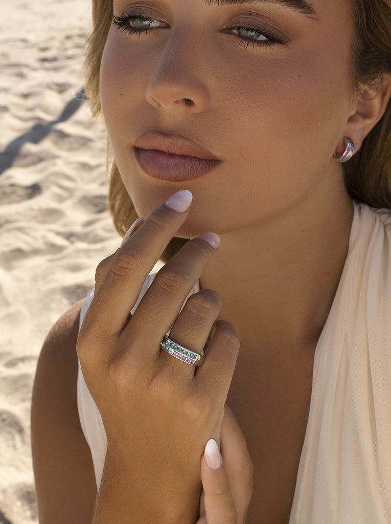 Silver ring with green, pink, and lilac stones