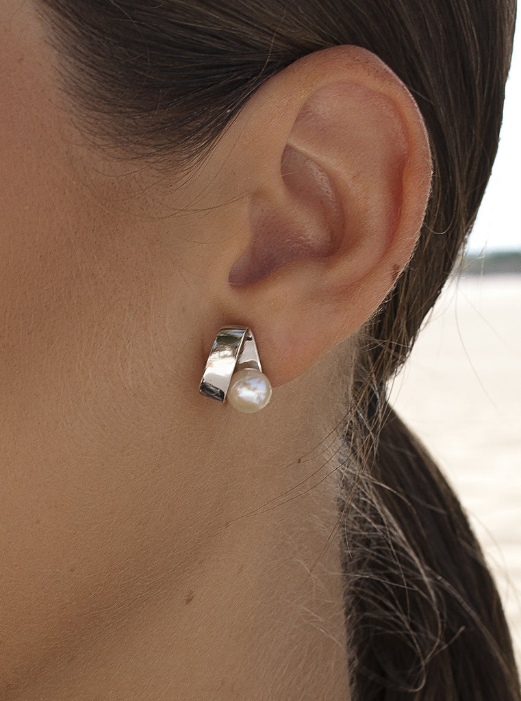 Sterling silver earrings with pearl and wraparound geometric design