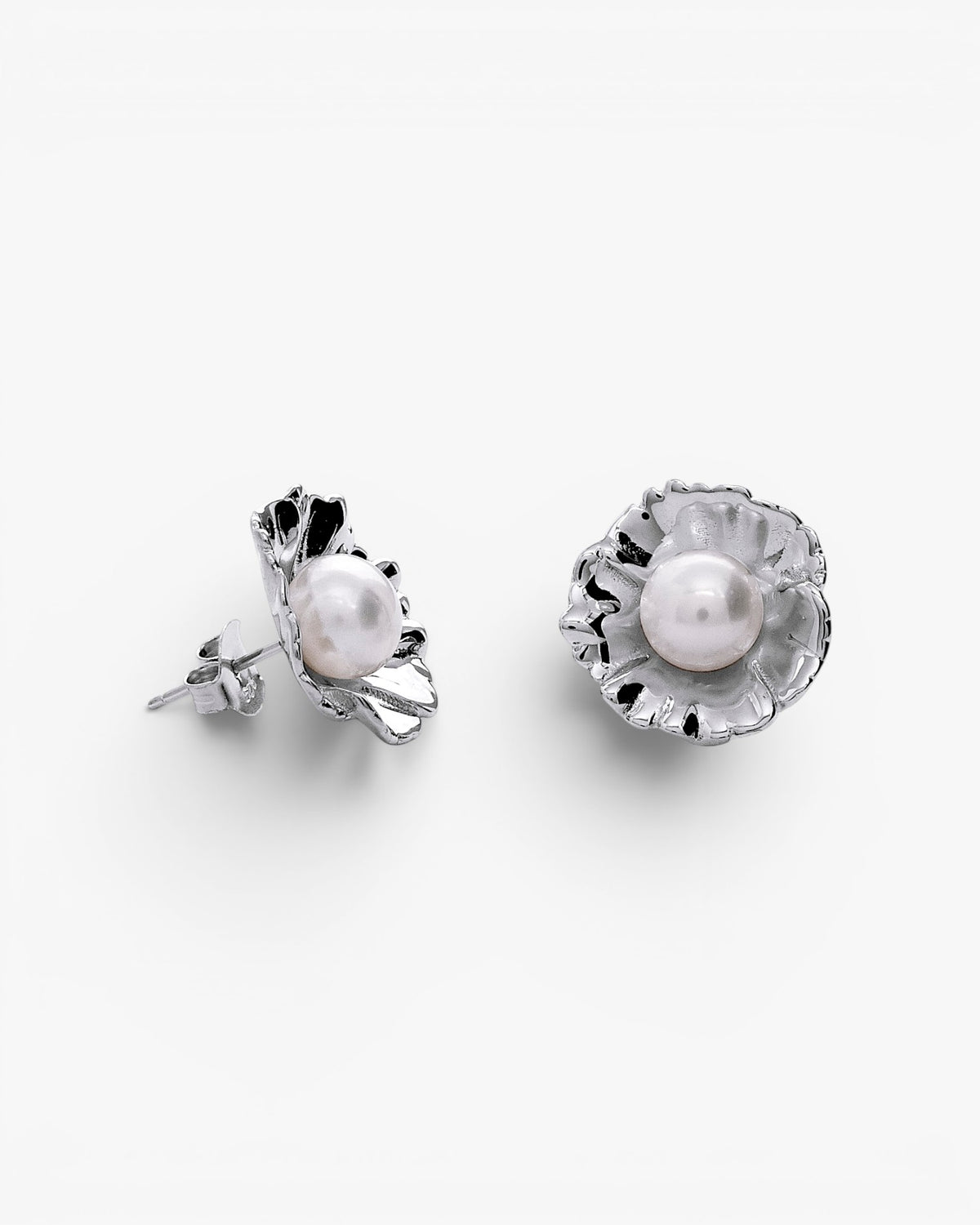 Silver flower earrings with a central pearl