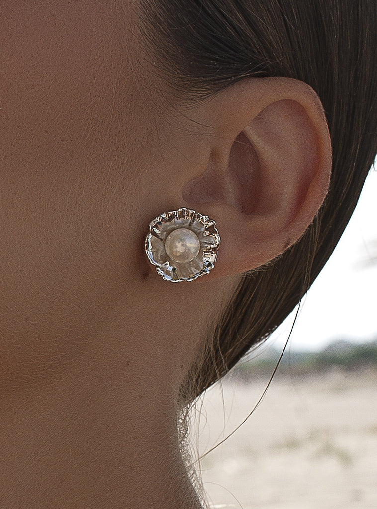 Silver flower earrings with a central pearl
