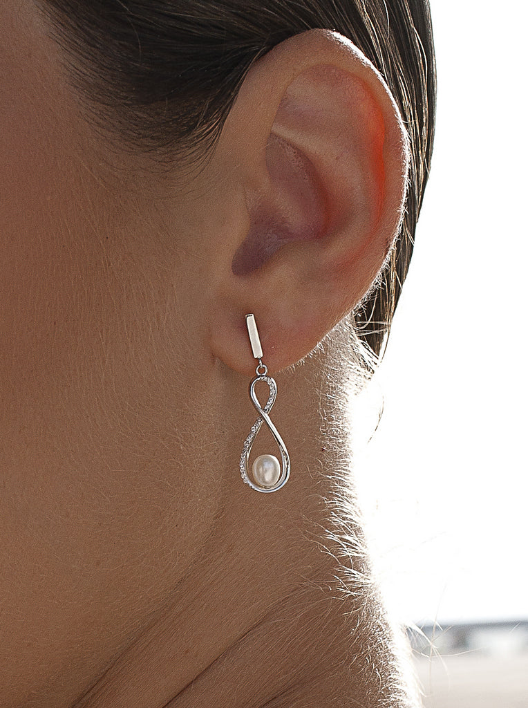 Silver infinity earrings with pearl and cubic zirconia