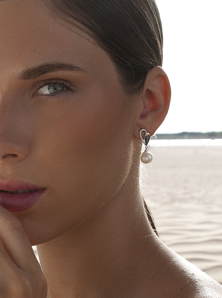 Silver earrings with pearl and leaf motif with cubic zirconia