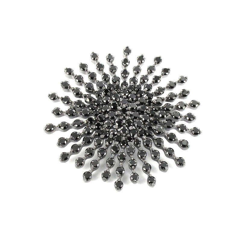 Broche de plata en rodiom negro con diseño de estrella con circonitas