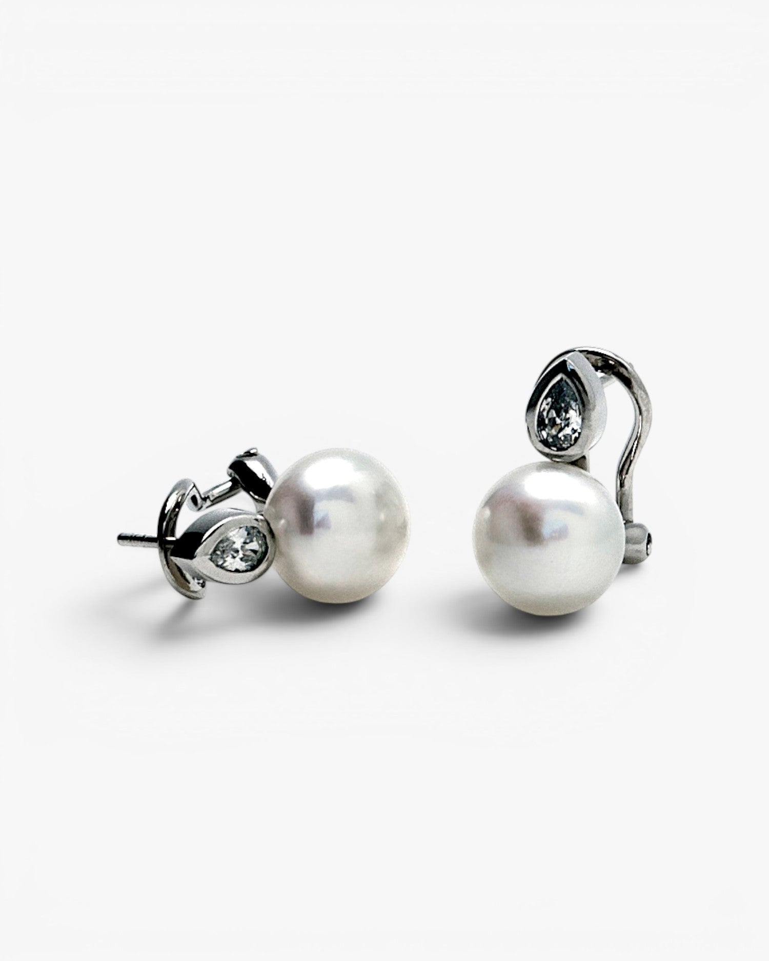 Pearl earrings in a toe-and-toe style with a teardrop detail and cubic zirconia