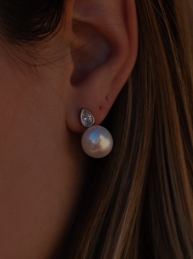 Pearl earrings in a toe-and-toe style with a teardrop detail and cubic zirconia