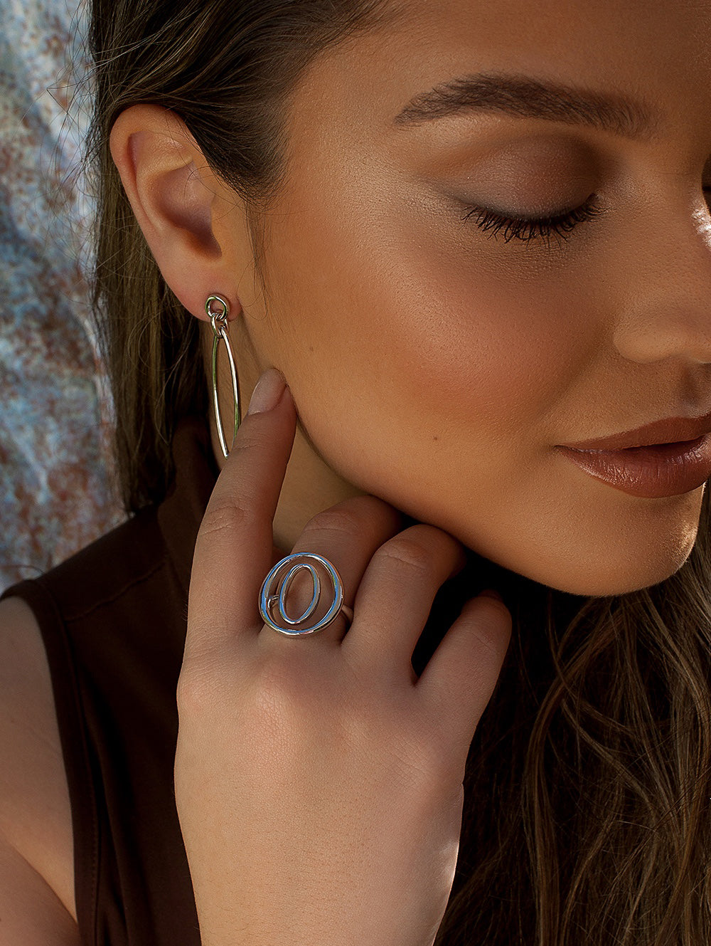 Rings Large in shape of two oval circles and plain silver