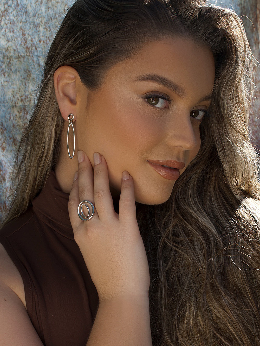 Rings Large in shape of two oval circles and plain silver