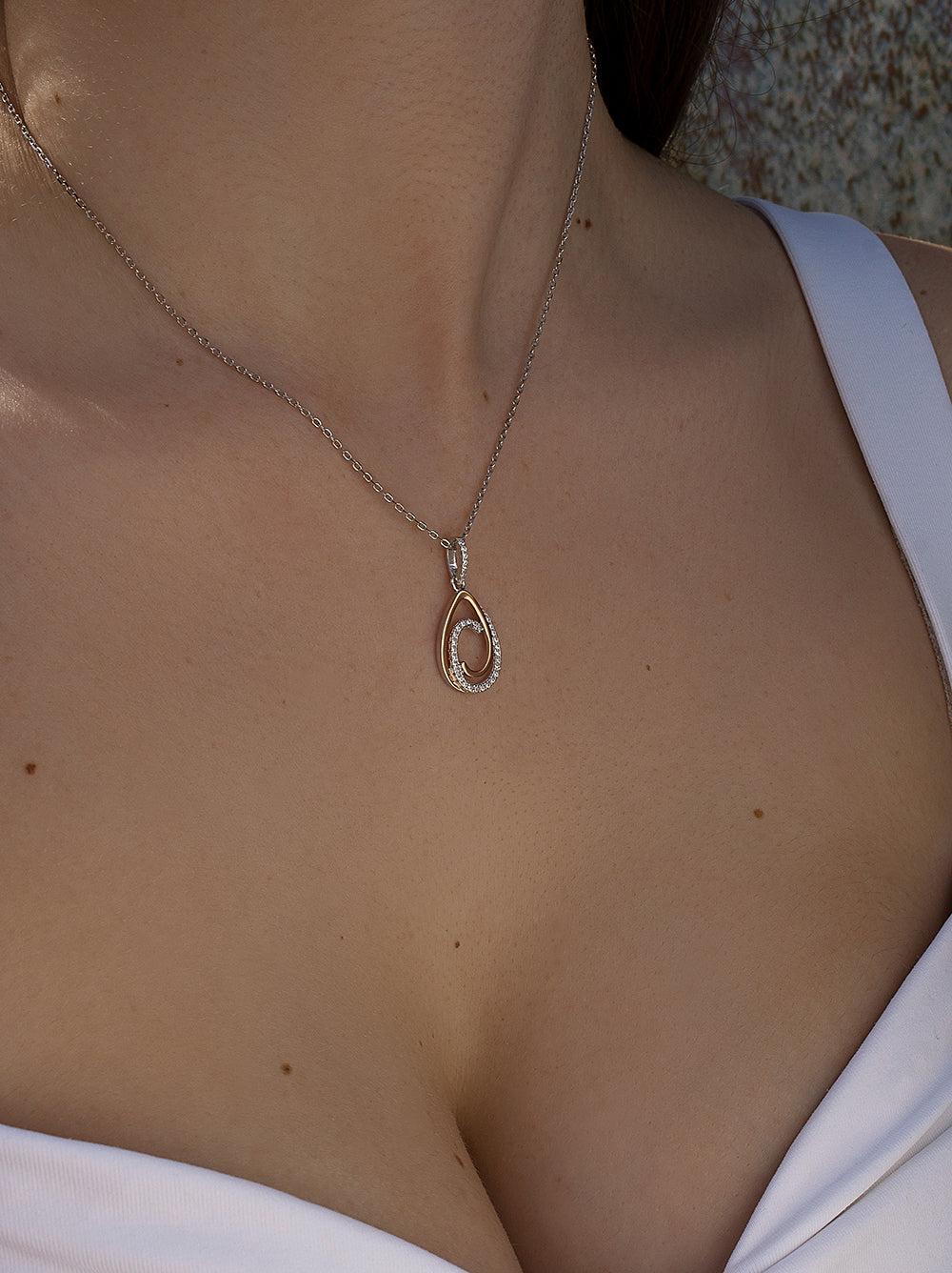 pendentifs bicolore argent design de deux créoles unis