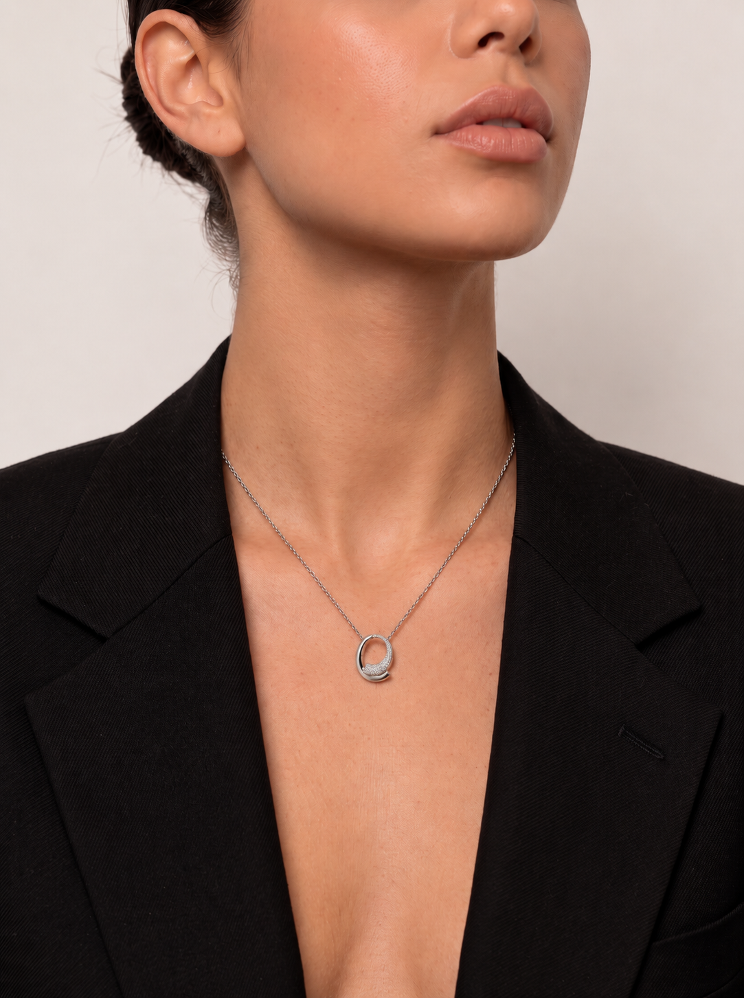 Silver necklace with circular design cubic zirconia