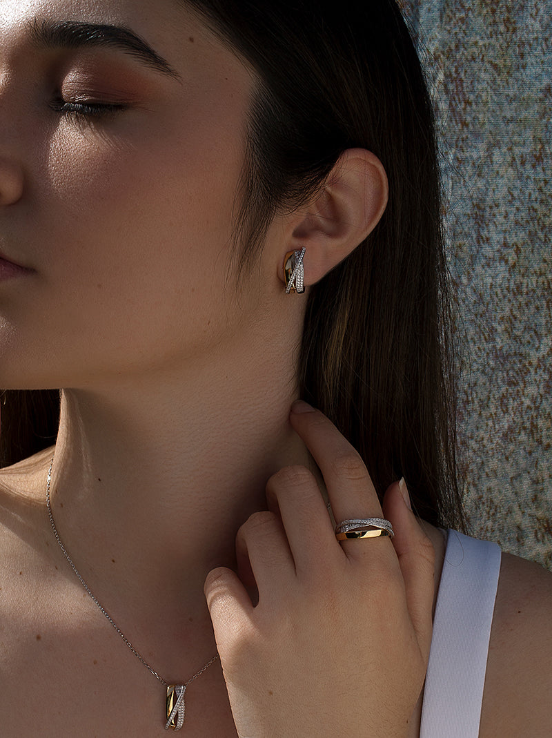 earrings omega clasp  with crossed zirconias band