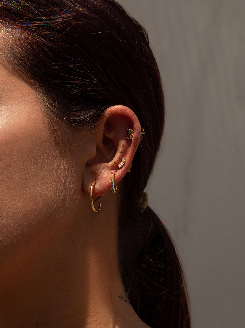 Piercing de plata bañada en oro diseño aro