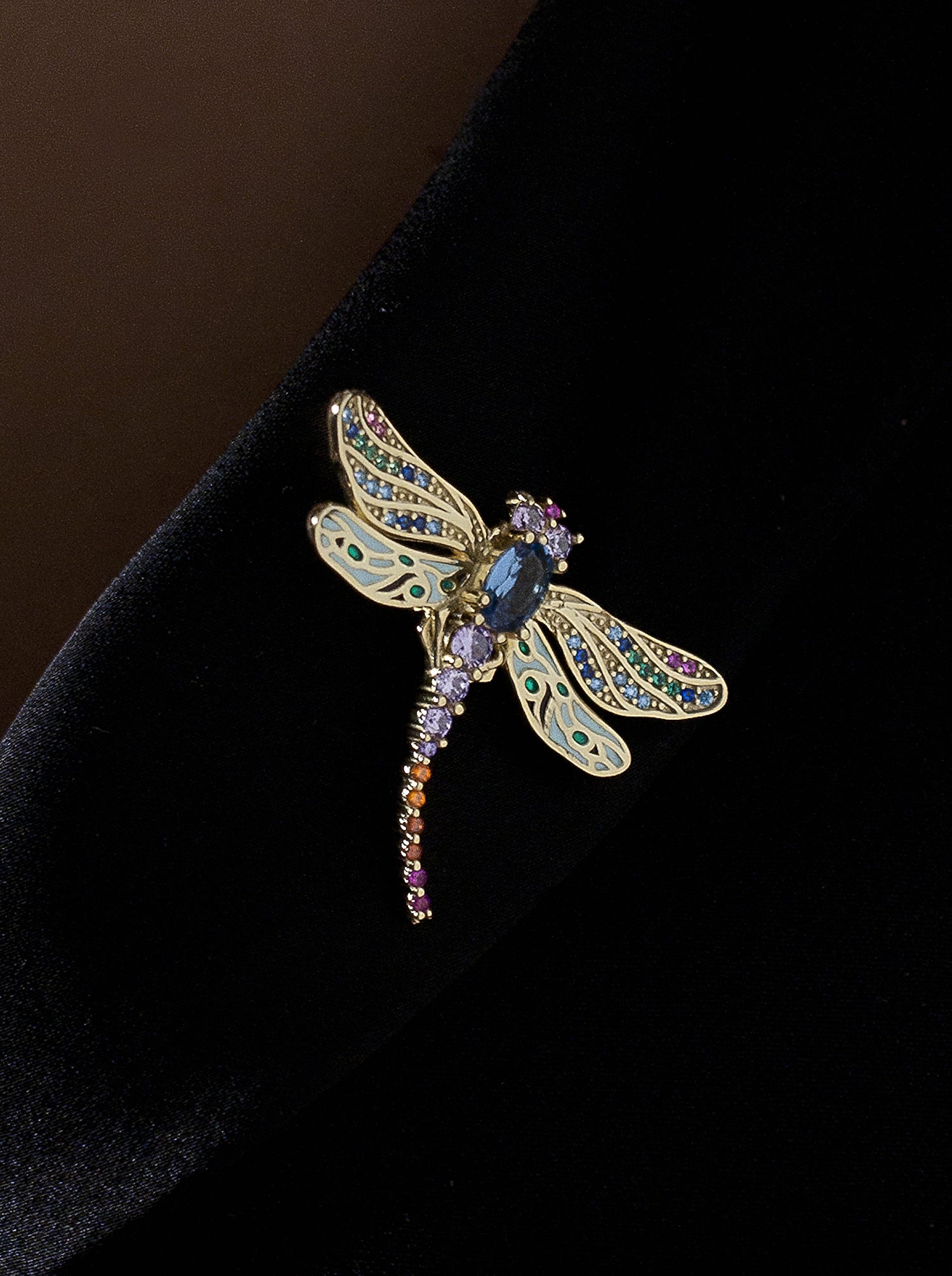 Silver brooch insect design in blue and violet tones