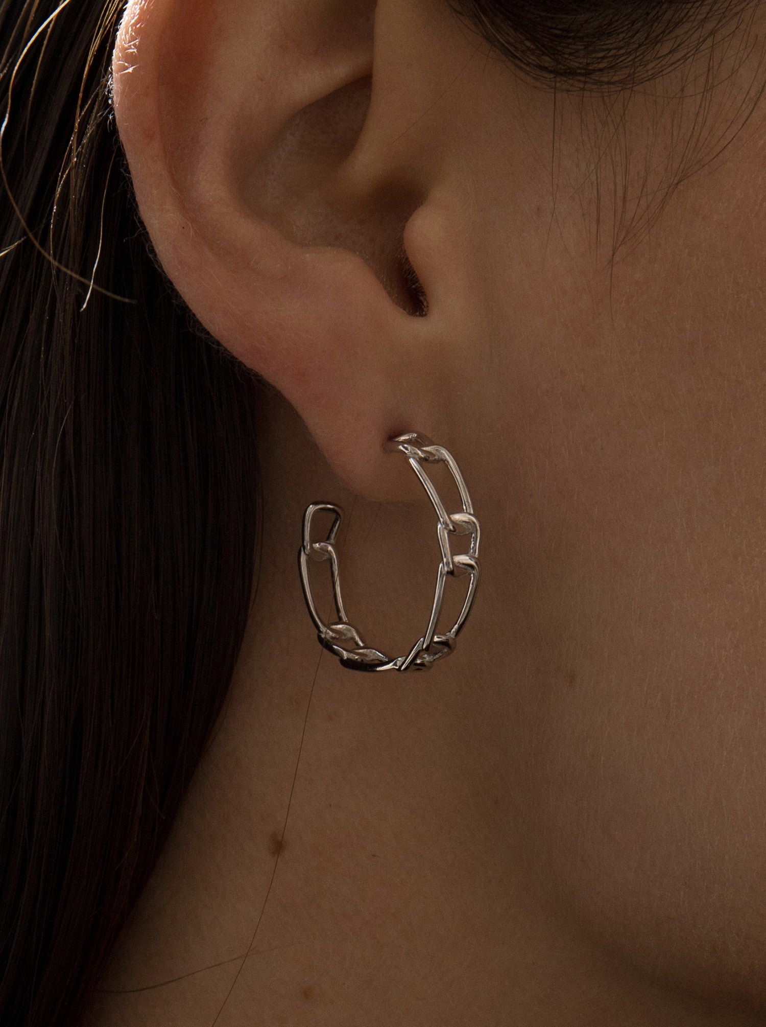 Silver hoop earrings chained design
