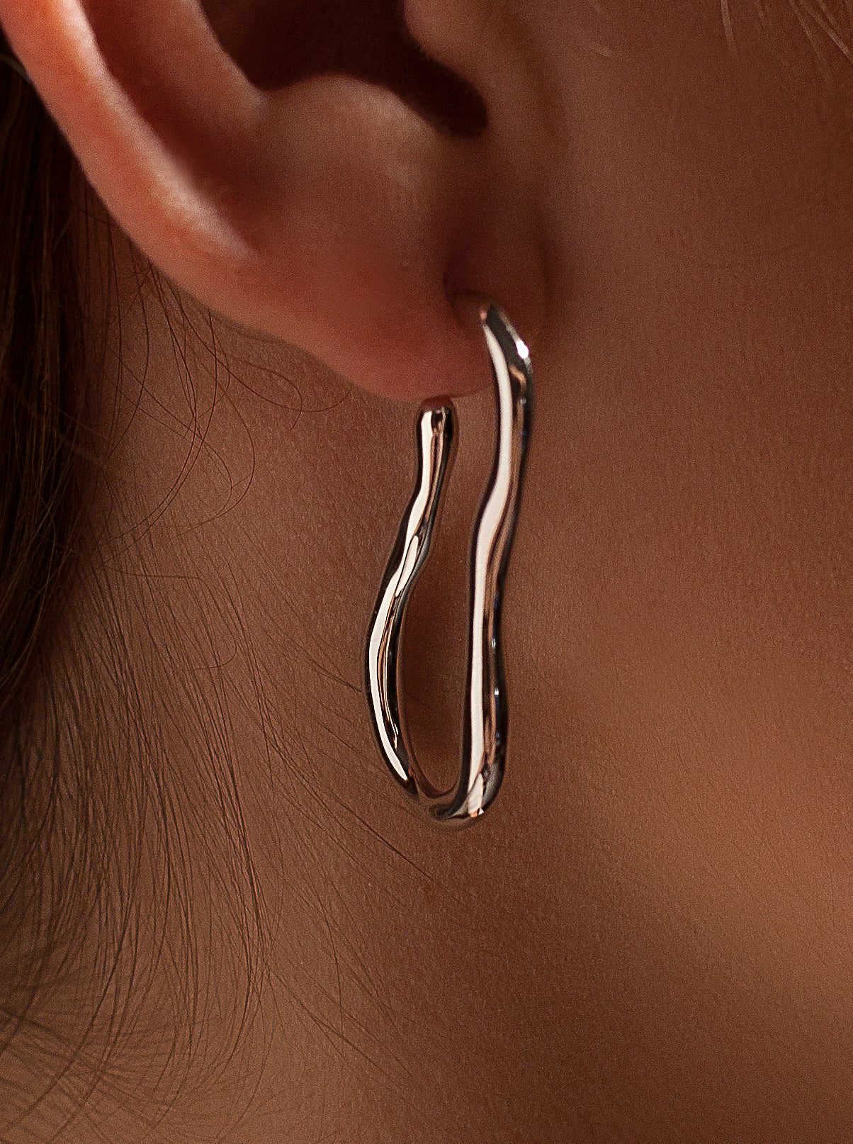 Irregular design silver hoop earrings