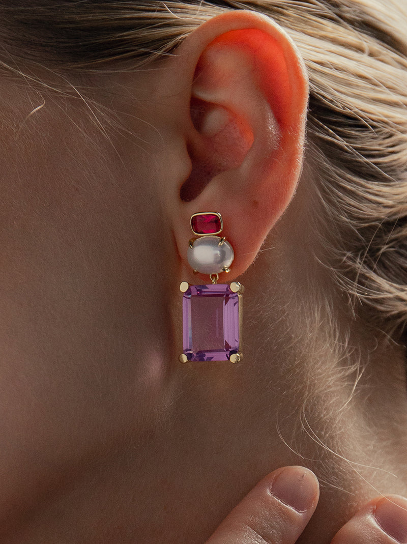 Earrings with colored stones in purple tones