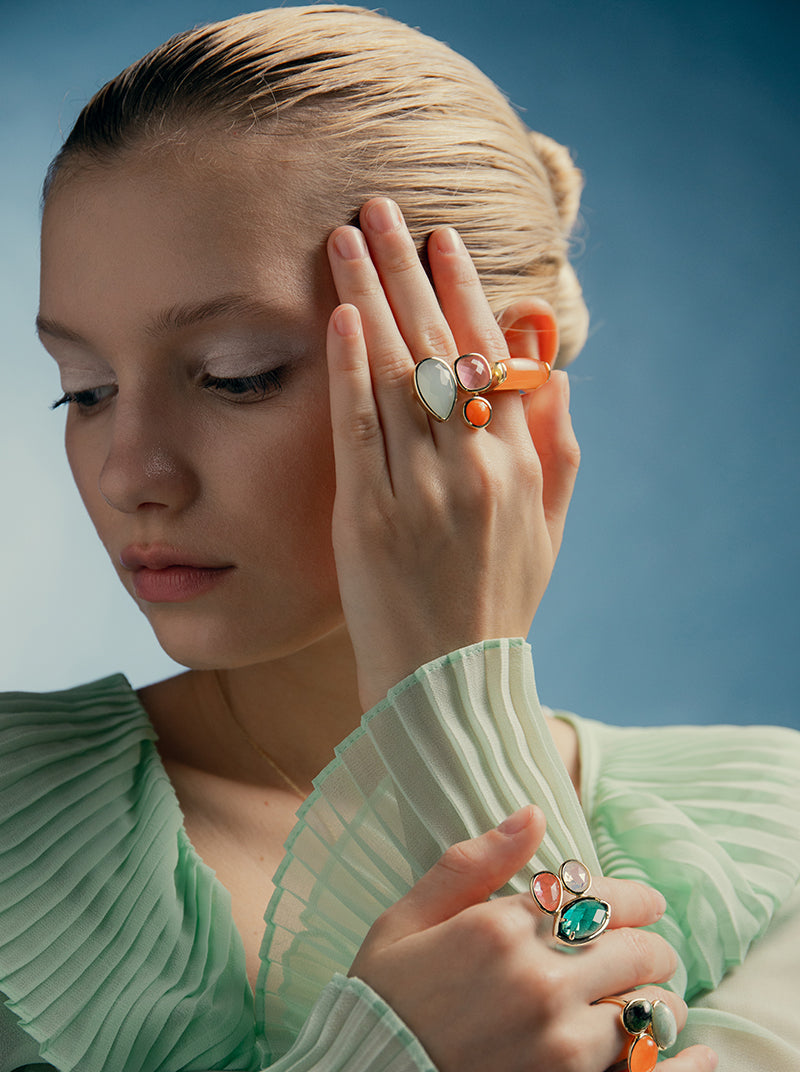 ring with orange tone stone in rectangular shape