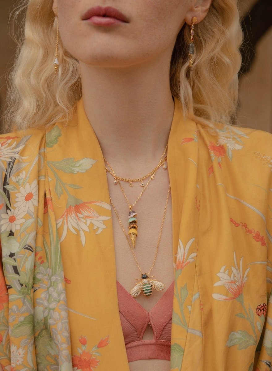 Collares dobles motivo de varios charms bañados en oro