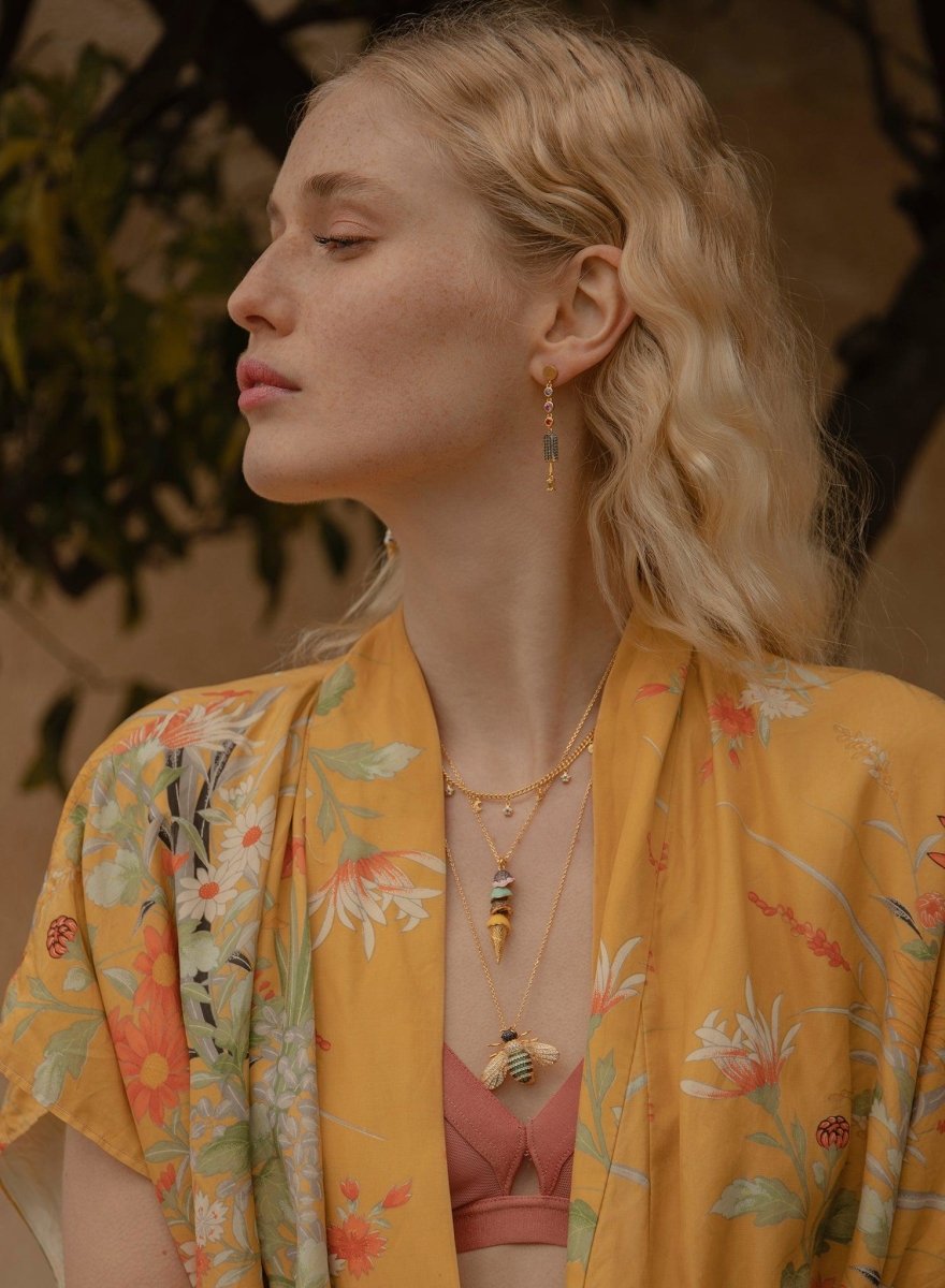 Collares dobles motivo de varios charms bañados en oro