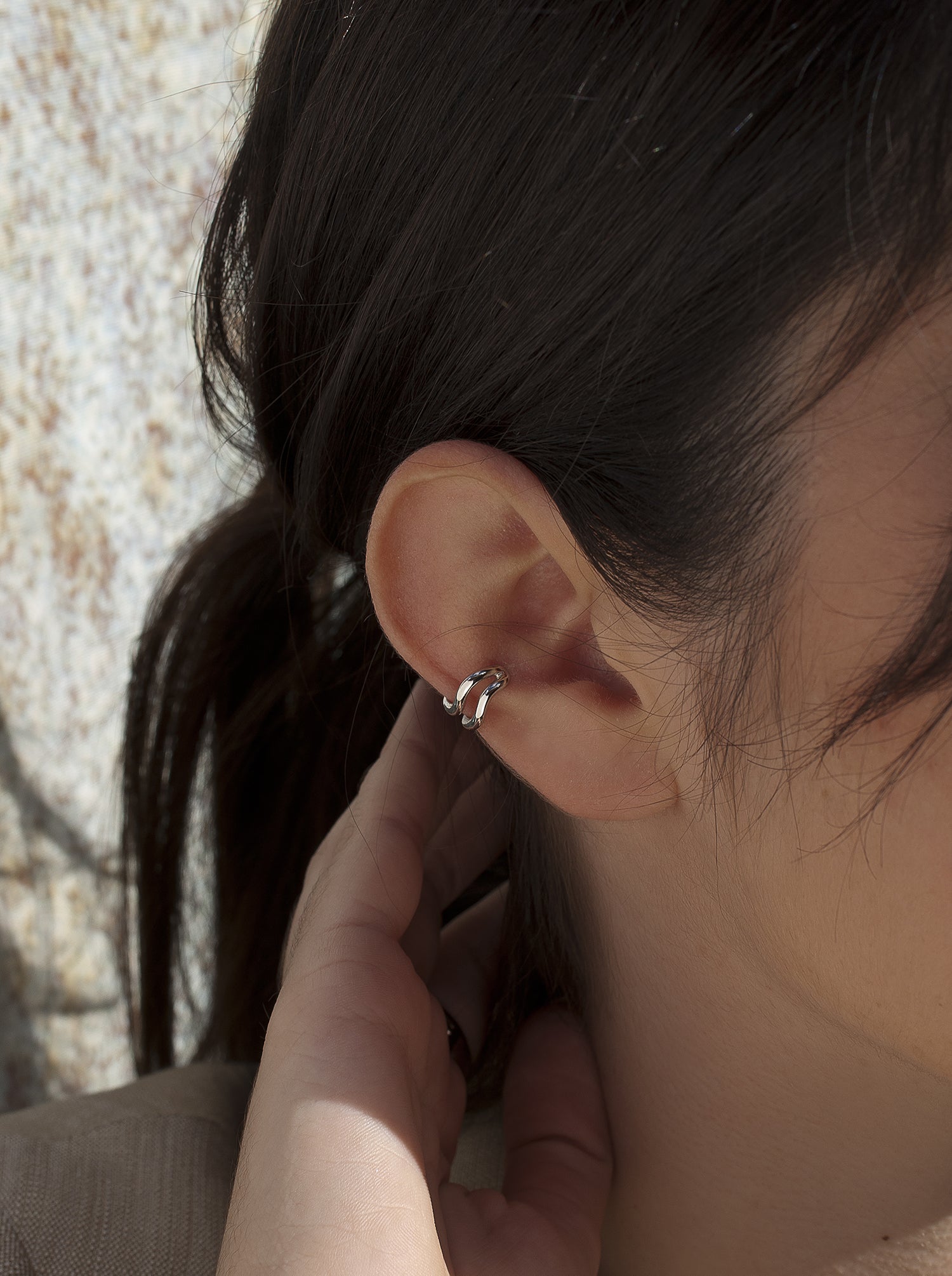 Silver Ear cuff formed by two hoops