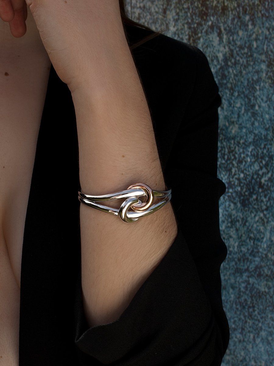 Slave two tone design intertwined knot