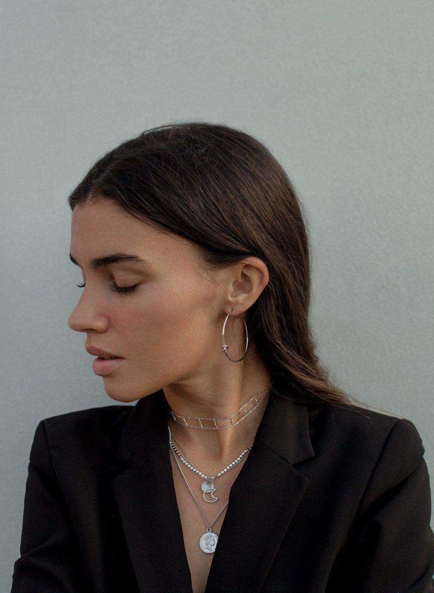 grandes boucles d'oreilles de créoles  et  détails de nœuds et lisseargent