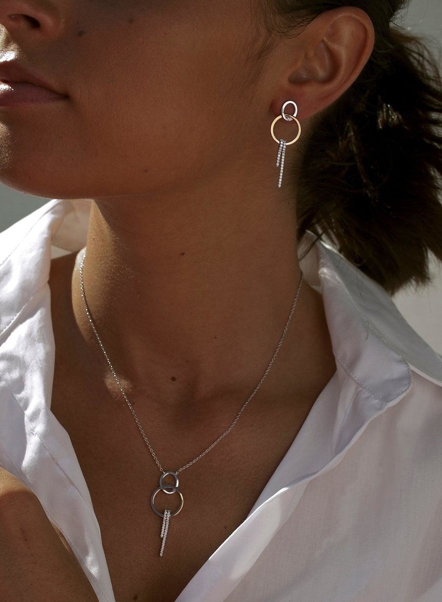 Pendientes bicolor diseño doble redonda con circonitas