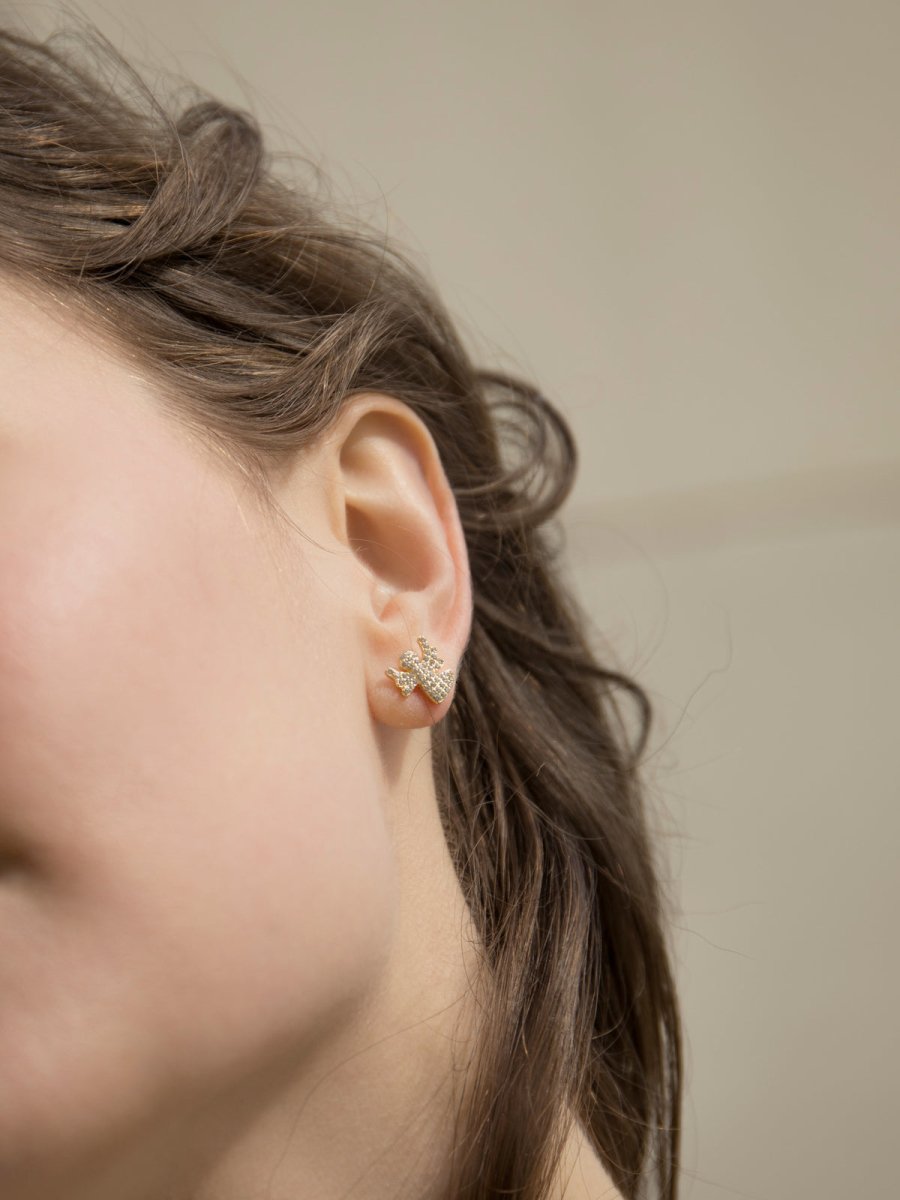 silver second earring with angel charm and zirconias