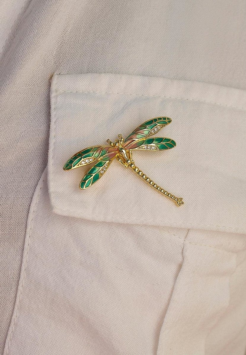 Brooch - Gold plated silver brooch with a dragonfly design composed of pink and green zirconias.
